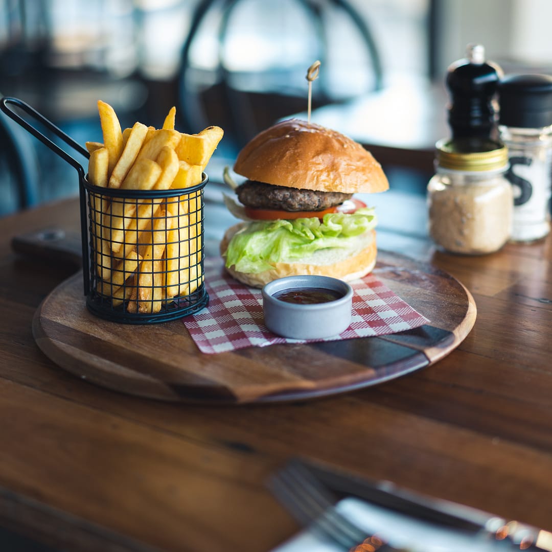 Burger with chips soft lighting photographed by Rani Joensen