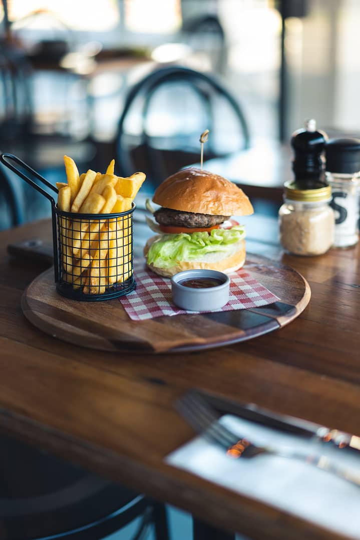 Burger with chips soft lighting photographed by Rani Joensen